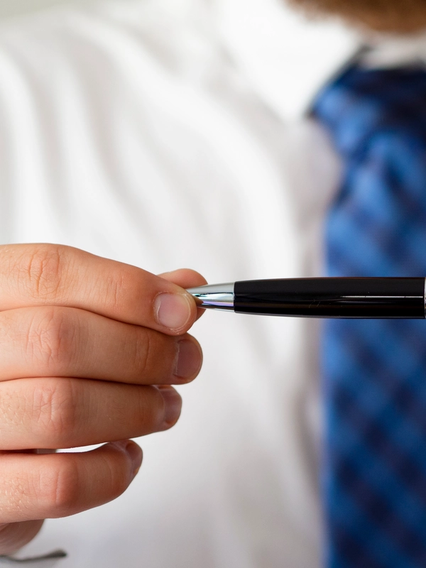 Close up hands holding pen mock up