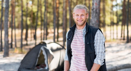 Happy man enjoying forest