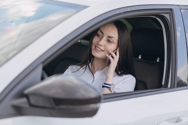 Woman talking phone while driving