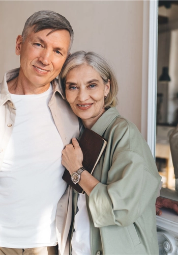 Happy elderly couple hugging in modern room 2024 01 26 18 39 52 utc